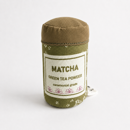 Play Food Matcha green tea powder container with label on a white background
