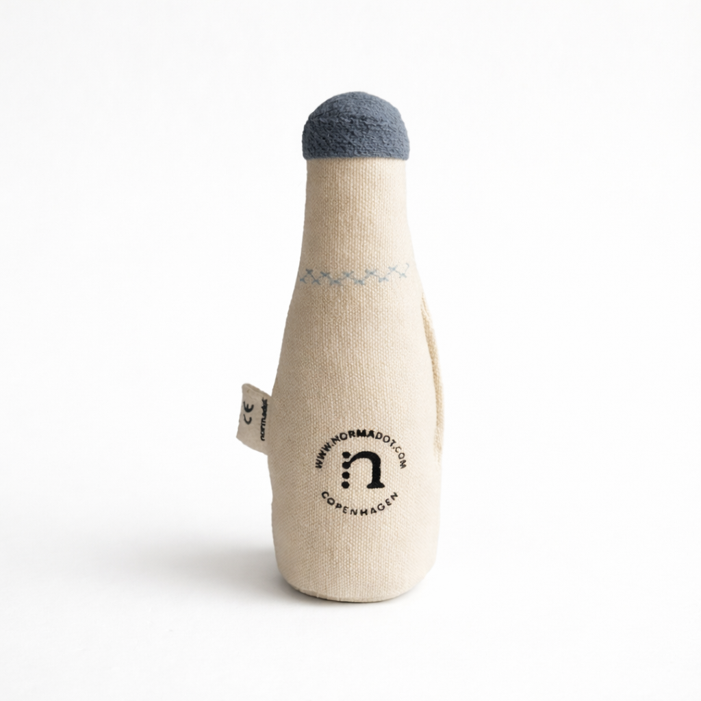 Toy bottle with a blue cap on a white background
