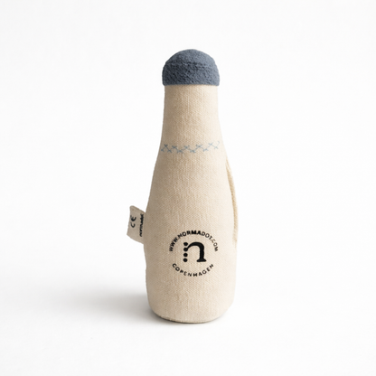 Toy bottle with a blue cap on a white background