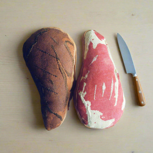 Dual-sided ribeye steak pretend-food toy—raw and grilled versions side-by-side with wooden-handle knife for play kitchens
